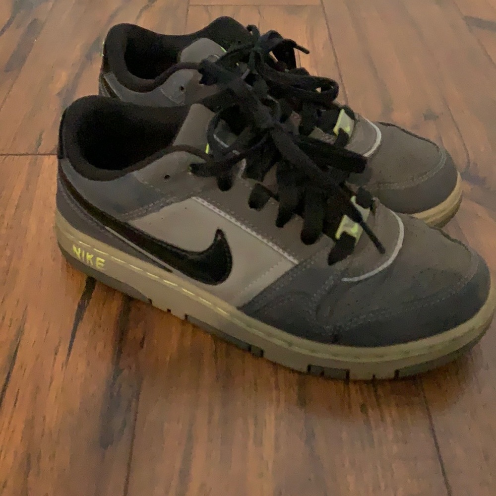 Lighted worn used Nike sneaker.
